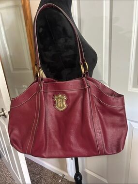 Pebbled Burgundy Leather Shoulder Bag with Gold Emblem